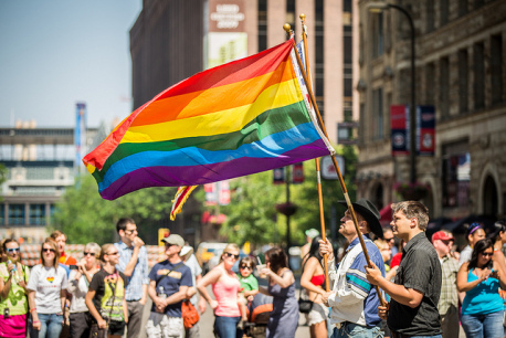 group of people at minneapolis pride rainbow flag
